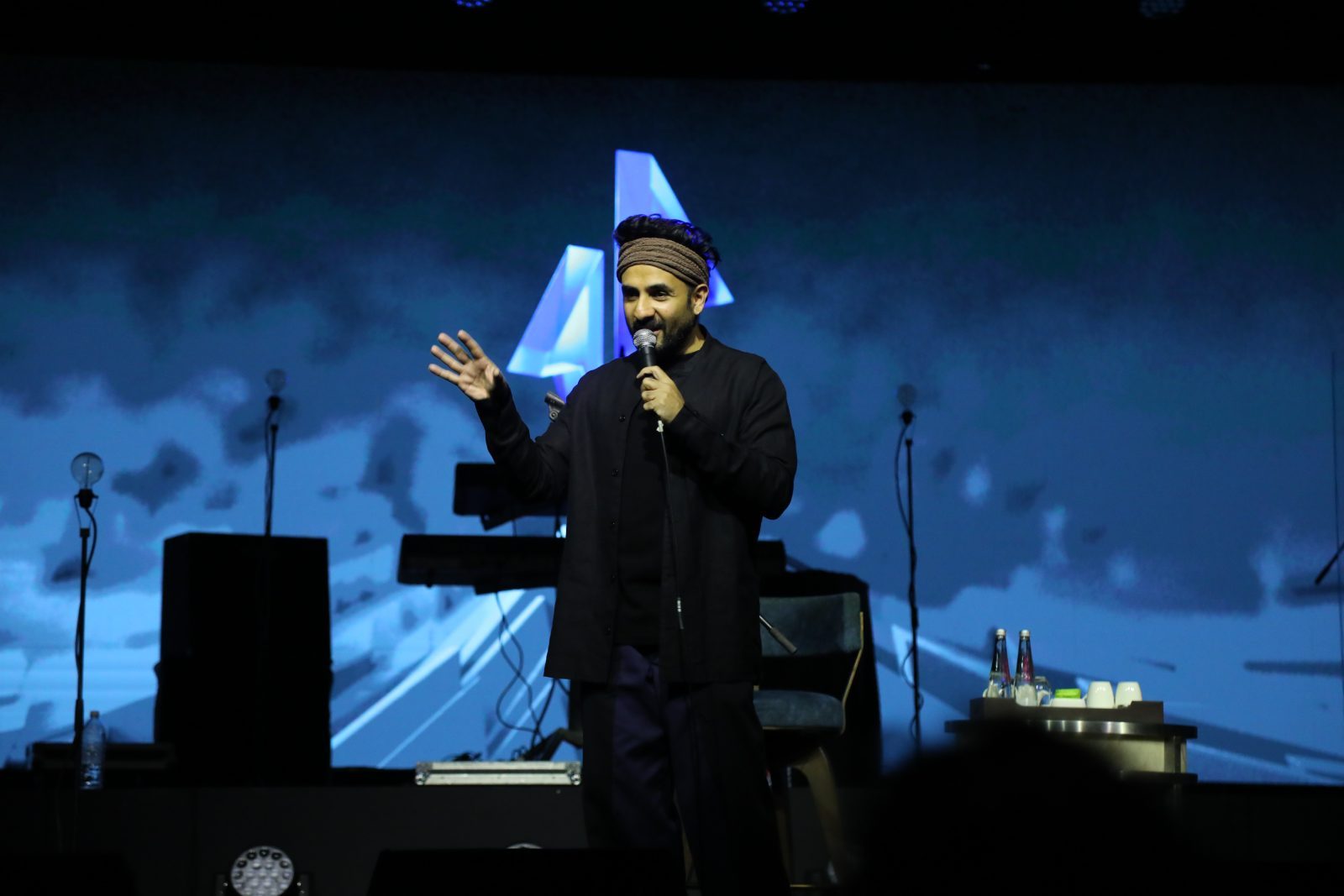 Artist performing to a packed audience